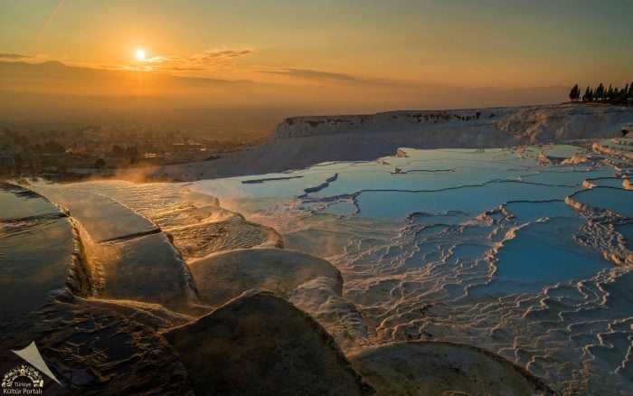 Golden sunset over the travertine pools of Pamukkale.
