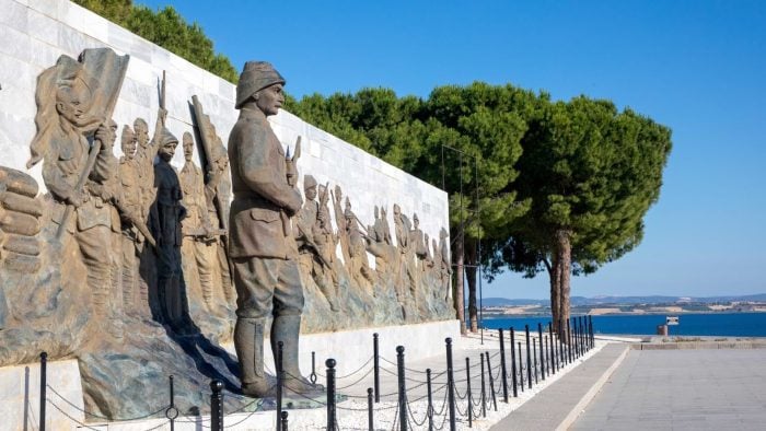 Anzac soldier memorial relief and statue beside the seafront promenade at Gallipoli