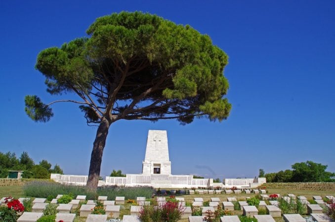 Lone Pine Cemetery with lone tree, memorial and white headstones on Gallipoli battlefield tour