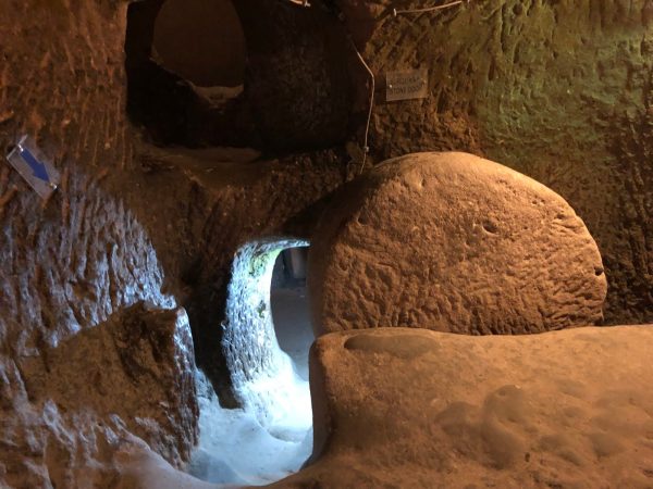 Ozkonak underground city round stone door tunnel cappadocia