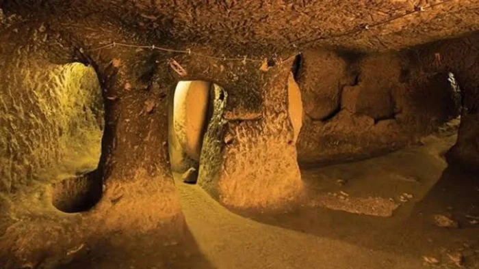 Ozkonak underground city stone door chamber cappadocia