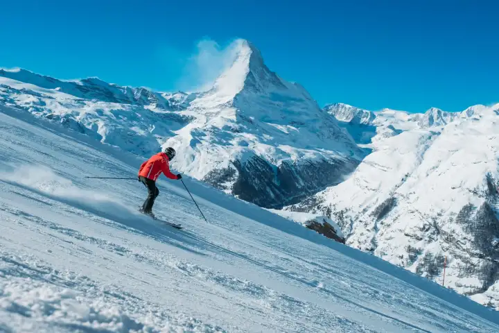Skier on a steep snowy slope with alpine scenery at Erciyes Ski Resort