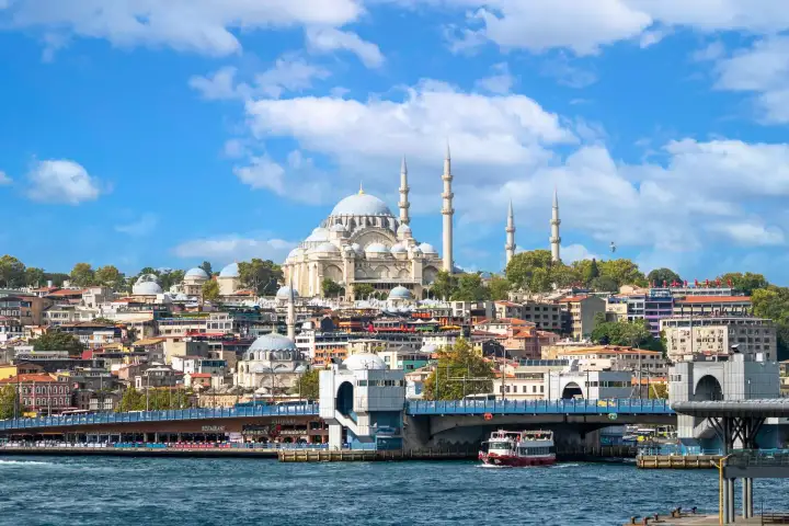 A panoramic view of Istanbul's waterfront from a Bosphorus cruise reveals hills, shoreline neighborhoods, and the timeless beauty of the city stretching along the strait.