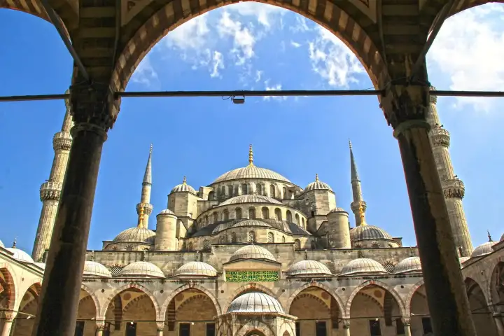 Blue Mosque view through a historic archway in Istanbul