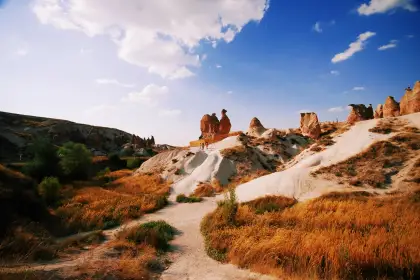 An unusual twin-spired fairy chimney formation resembling two figures in Devrent Imagination Valley, one of the Red Tour's most talked-about natural sculptures in Cappadocia.