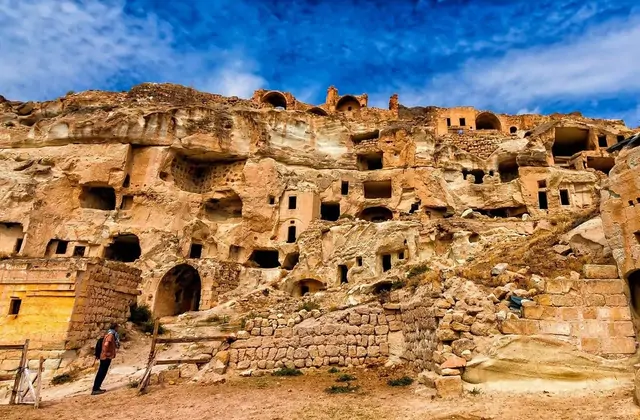 Conical rock spires visible from Çavuşin village in Cappadocia, providing a dramatic backdrop to the centuries-old cave settlement on the Cappadocia Yellow Tour.